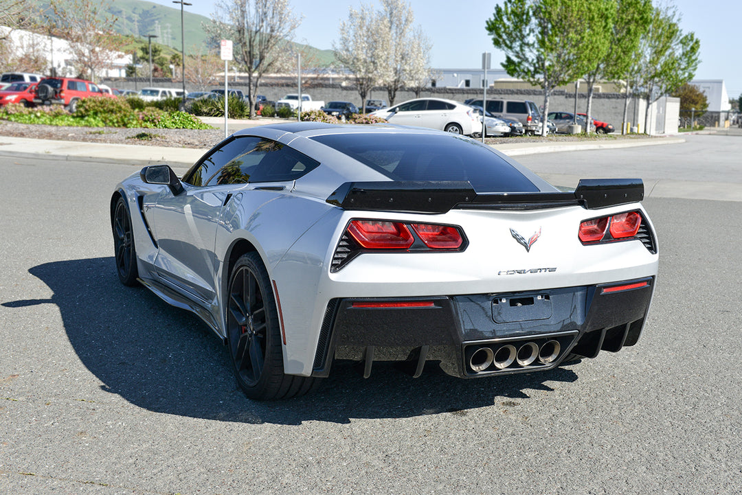 What is the use of wings in racing cars?