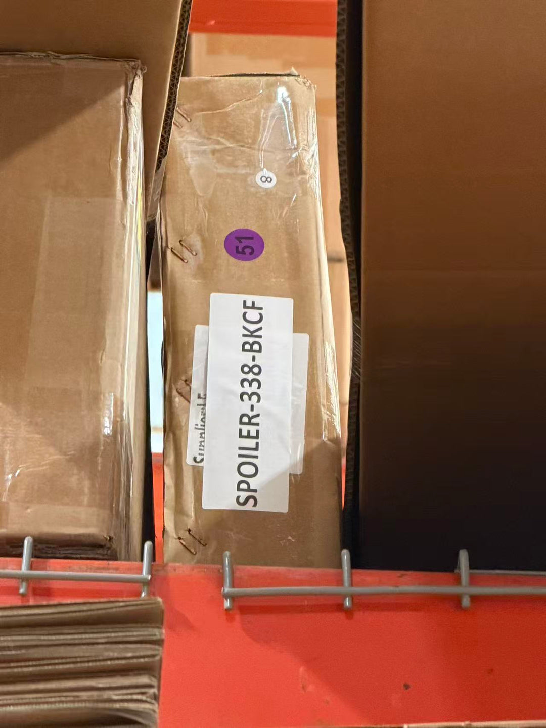Actual outlet unit SPOILER-338-BKCF-C-51 - shipping box with item label as received