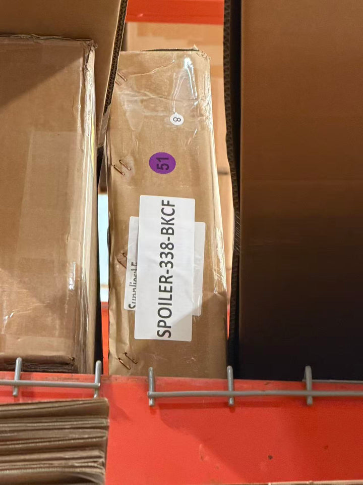 Actual outlet unit SPOILER-338-BKCF-C-51 - shipping box with item label as received
