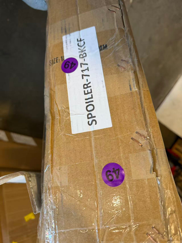 Actual outlet unit SPOILER-717-BKCF-C-49 - shipping box with item label as received
