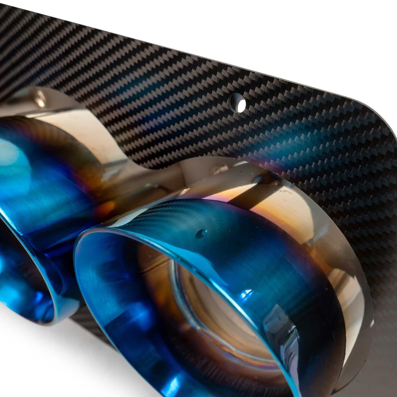 Detailed close-up of the 2023 Chevrolet Corvette C8 Z06 ZR1 titanium quad exhaust tips, highlighting the precision craftsmanship and premium metallic finish.