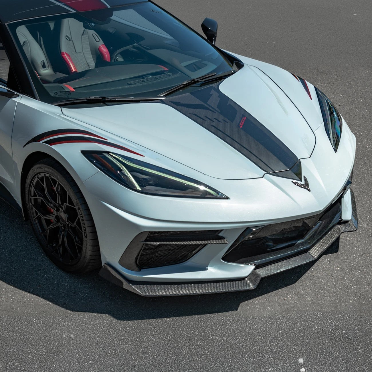 Front splitter ground effect for Corvette C8 with 5VM package, featuring aggressive aerodynamic design and premium factory-style fitment.