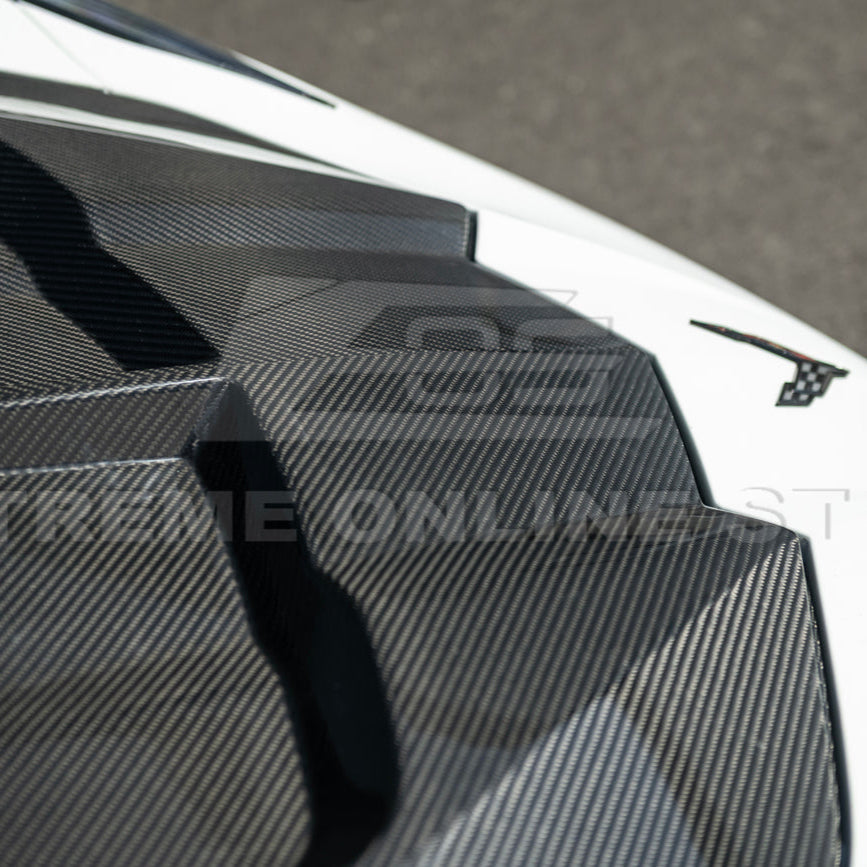 Close-up image of the Corvette C8 EOS Performance Track Style Double-Sided Dry Carbon Fiber Front Hood showing the premium dry carbon weave, lightweight construction, and aggressive aerodynamic design that enhances both performance and style.