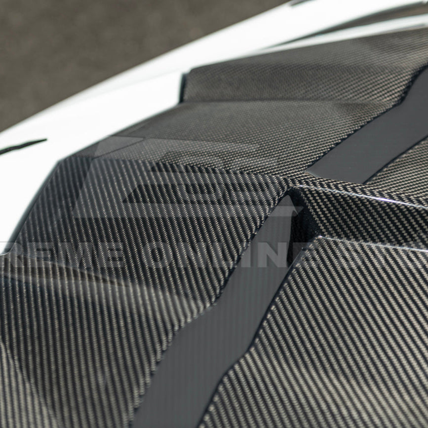 Close-up image of the Corvette C8 EOS Performance Track Style Double-Sided Dry Carbon Fiber Front Hood showing the premium dry carbon weave, lightweight construction, and aggressive aerodynamic design that enhances both performance and style.