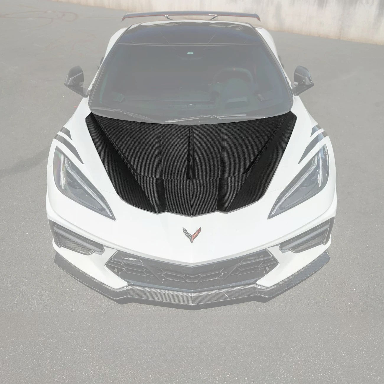 Close-up image of the Corvette C8 EOS Performance Track Style Double-Sided Dry Carbon Fiber Front Hood showing the premium dry carbon weave, lightweight construction, and aggressive aerodynamic design that enhances both performance and style.