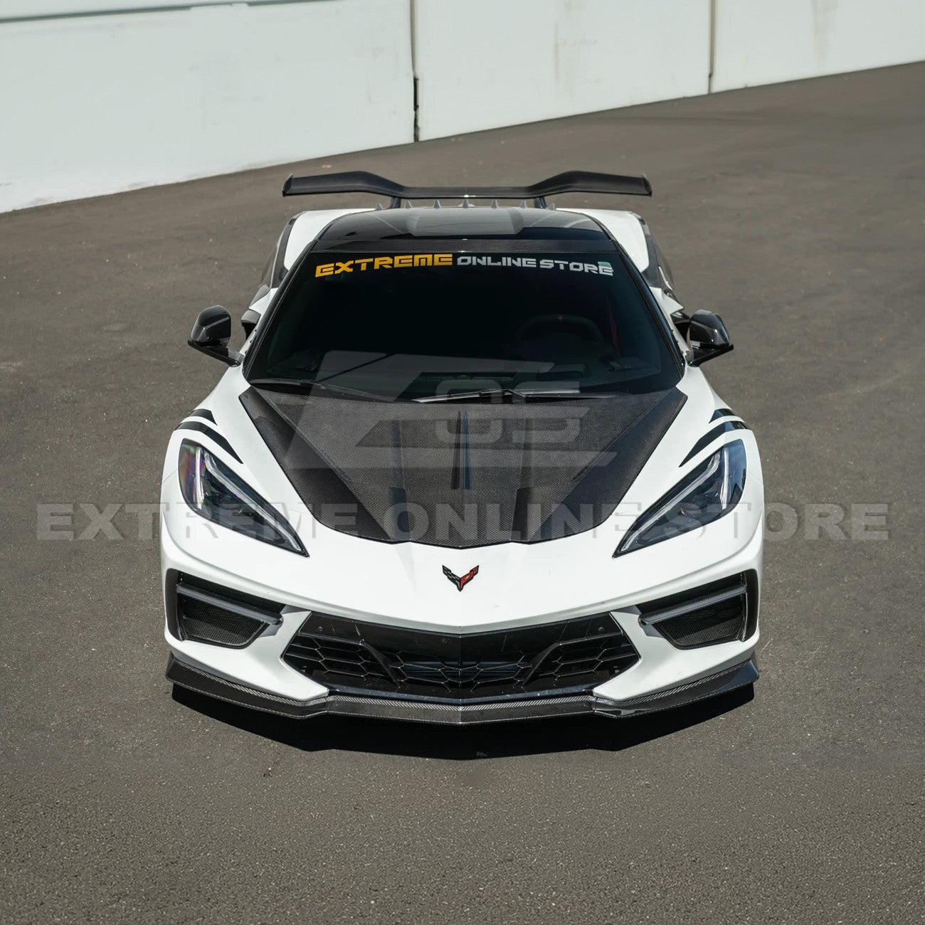 Close-up image of the Corvette C8 EOS Performance Track Style Double-Sided Dry Carbon Fiber Front Hood showing the premium dry carbon weave, lightweight construction, and aggressive aerodynamic design that enhances both performance and style.