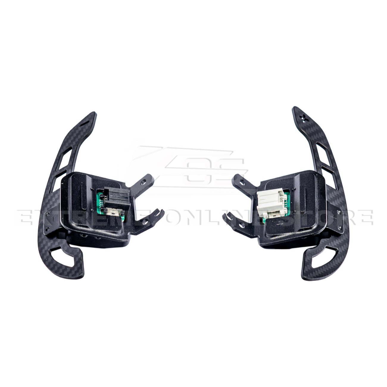 Close-up view of Corvette C8 steering wheel magnetic paddle shifters installed, showing premium aluminum finish and sporty design.