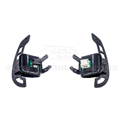 Close-up view of Corvette C8 steering wheel magnetic paddle shifters installed, showing premium aluminum finish and sporty design.