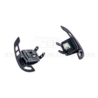 Close-up view of Corvette C8 steering wheel magnetic paddle shifters installed, showing premium aluminum finish and sporty design.