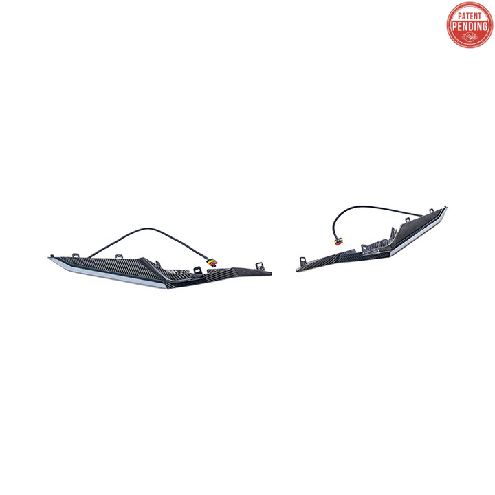 High-quality image of Corvette C8 Z06 Carbon Fiber Sequential LED DRL Light Bar Bezel Insert showcasing the sleek carbon fiber finish and modern LED design that enhances the C8’s front-end style and lighting performance.
