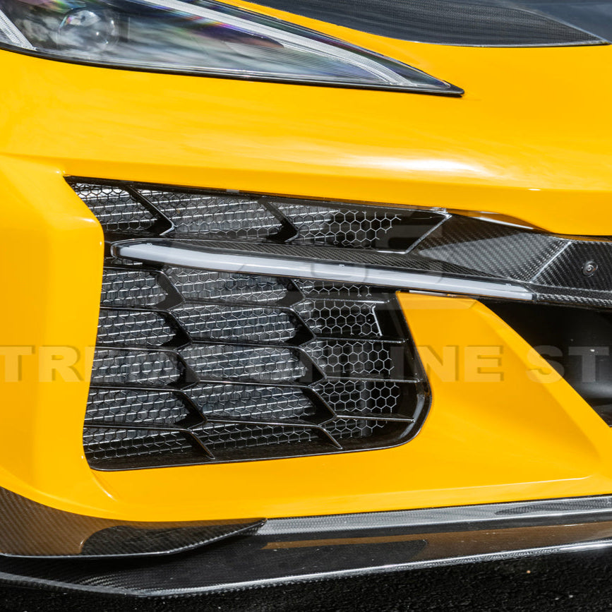 High-quality image of Corvette C8 Z06 Carbon Fiber Sequential LED DRL Light Bar Bezel Insert showcasing the sleek carbon fiber finish and modern LED design that enhances the C8’s front-end style and lighting performance.